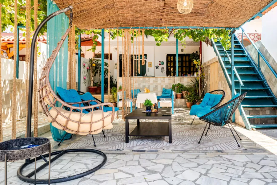 courtyard lounge area with hanging chair